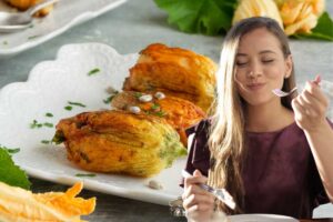 fiori di zucca e donna che mangia