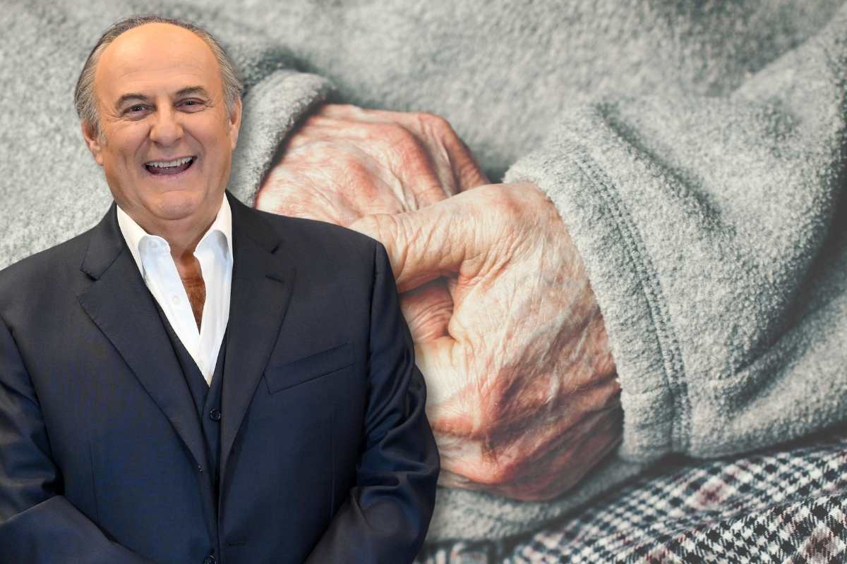 Mano di anziano e Gerry Scotti