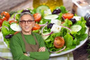 Bruno Barbieri e insalata come sfondo