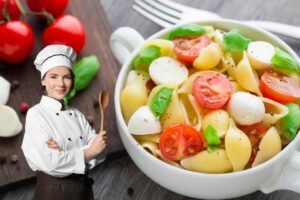 pasta con pomodori e basilico e donna chef con mestolo legno