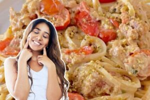 ragazza in primo piano e spaghetti con tonno e pomodorini