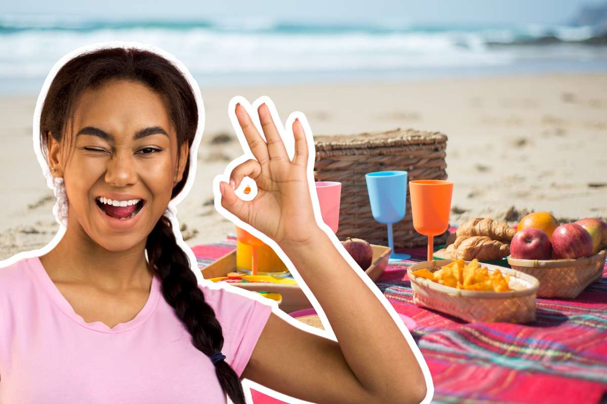 cibo in spiaggia e donna gesto ok